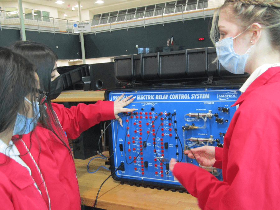 Demonstrating how to use the Amatrol’s electric relay control unit.