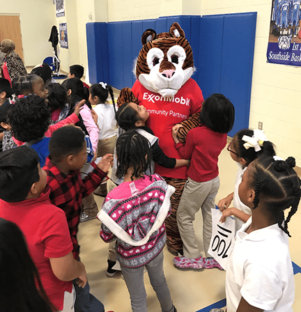 Dressed as the ExxonMobil tiger at a pep rally at Charlton Pollard Elementary School in Beaumont, Texas, Erika Anderson had a dance off with its bulldog mascot.