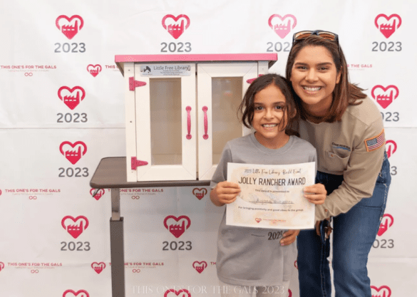 Gutierrez’s daughter Aiyana being awarded at a Little Library Build event hosted by This One’s for the Gals. 